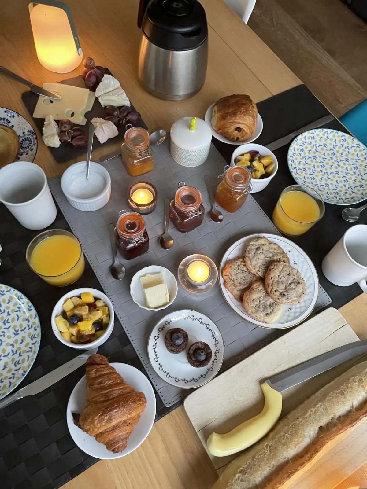 Effet Lodge breakfast from above: pastries, orange juice, jams, cheese and fruit