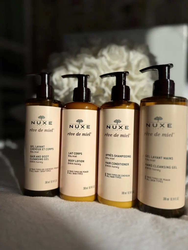 Four bottles of Nuxe Rêve de miel, cleansing gels, body lotion and conditioner, provided at Le 36