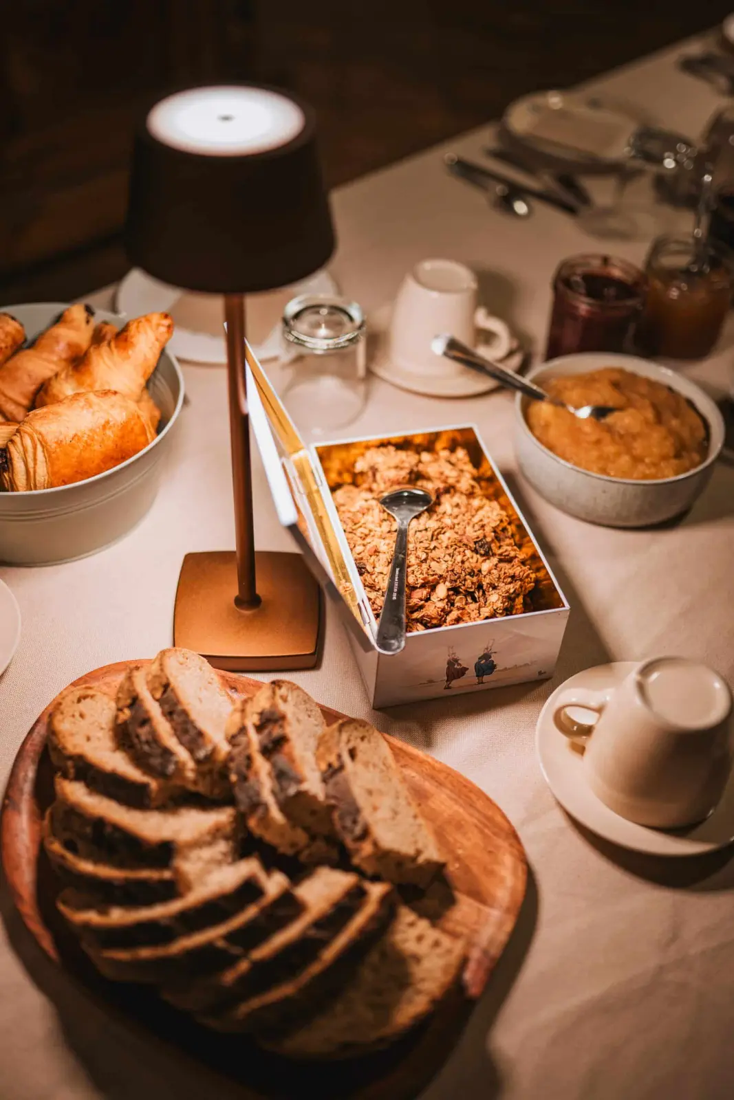 Breakfast at Ty Monde: sliced country bread, pastries, granola, stewed fruit and jams